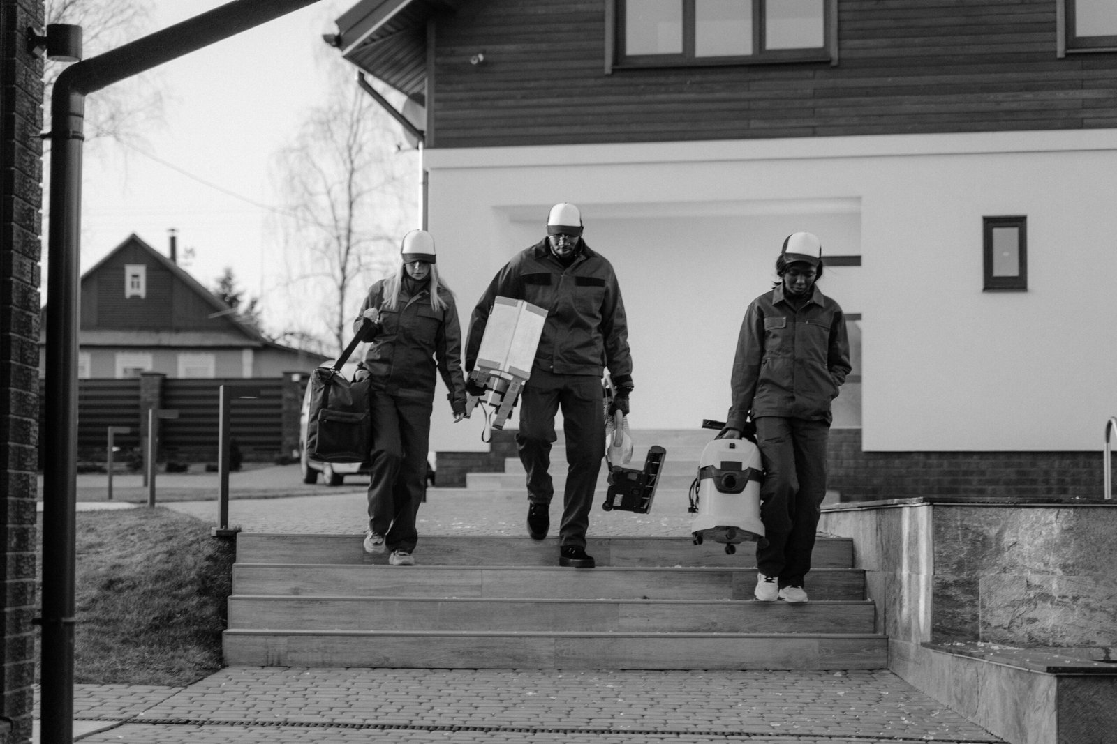 Grayscale Photo of 2 Men in Police Uniform Standing on Sidewalk